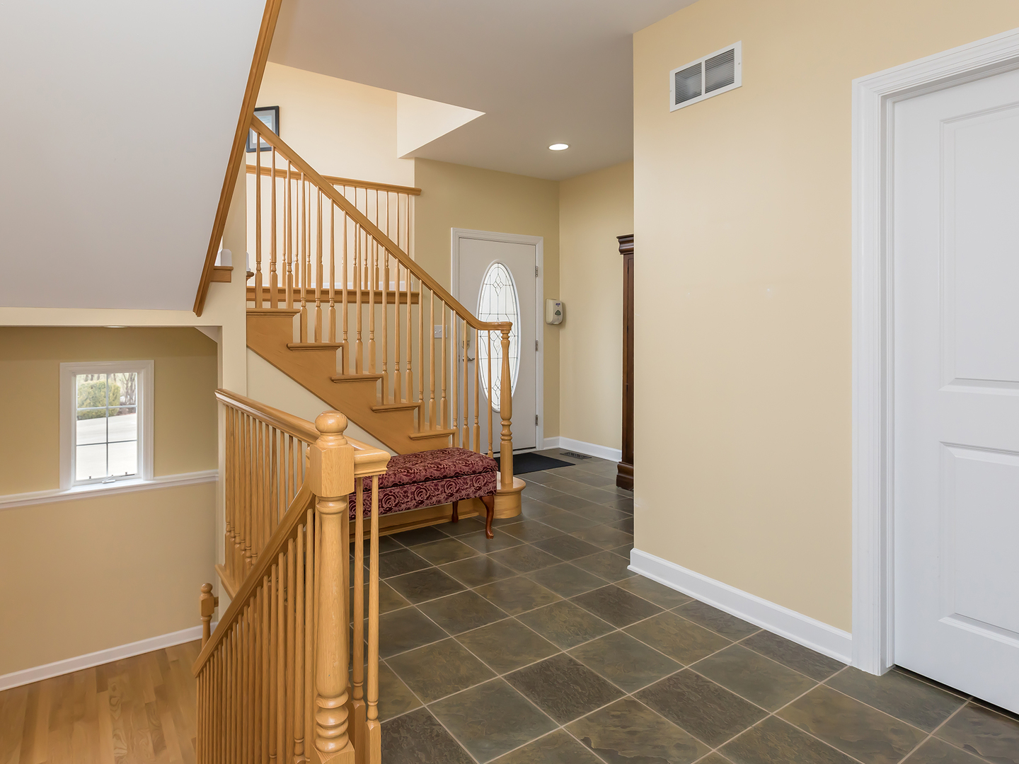 3N480 Fair Oaks Road West Chicago, IL 60185 - Photo 12 of 25 a view of entryway with wooden floor and stairs