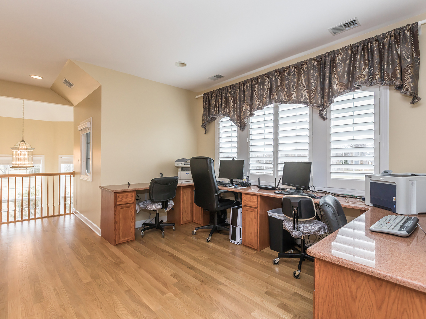 3N480 Fair Oaks Road West Chicago, IL 60185 - Photo 14 of 25 a view of a workspace with furniture and a window