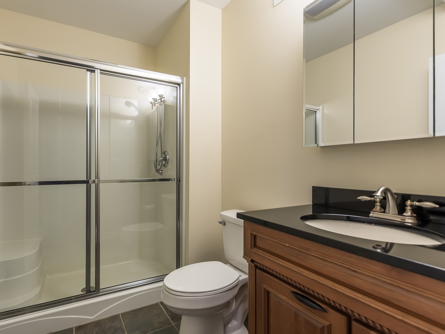 3N480 Fair Oaks Road West Chicago, IL 60185 - Photo 22 of 25 a bathroom with a sink toilet and shower