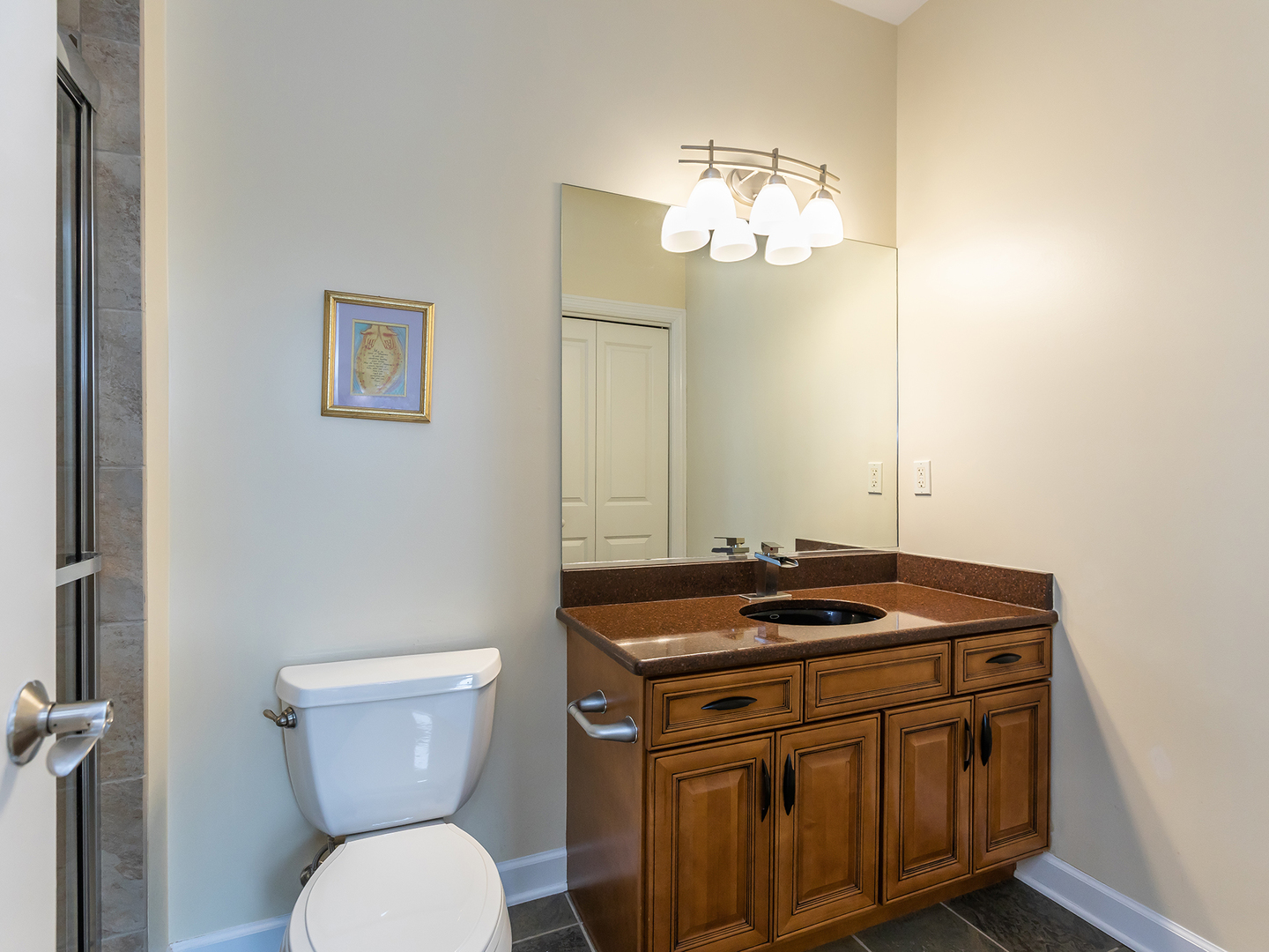 3N480 Fair Oaks Road West Chicago, IL 60185 - Photo 23 of 25 a bathroom with a granite countertop toilet sink and mirror