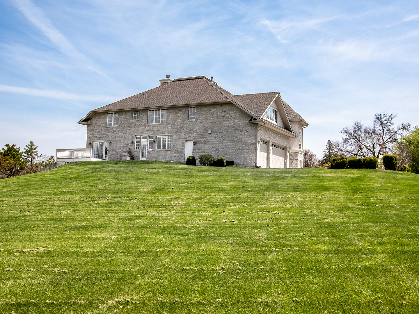 3N480 Fair Oaks Road West Chicago, IL 60185 - Photo 25 of 25 a house that is sitting in the grass with large trees