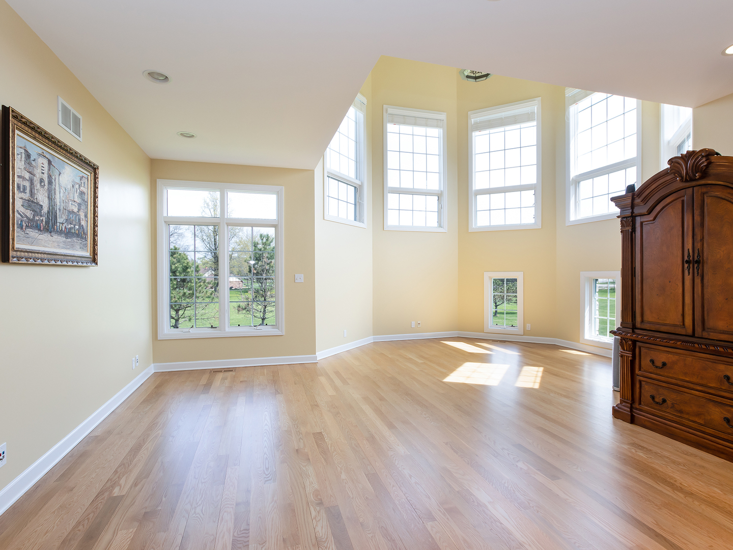 3N480 Fair Oaks Road West Chicago, IL 60185 - Photo 5 of 25 an empty room with wooden floor and windows