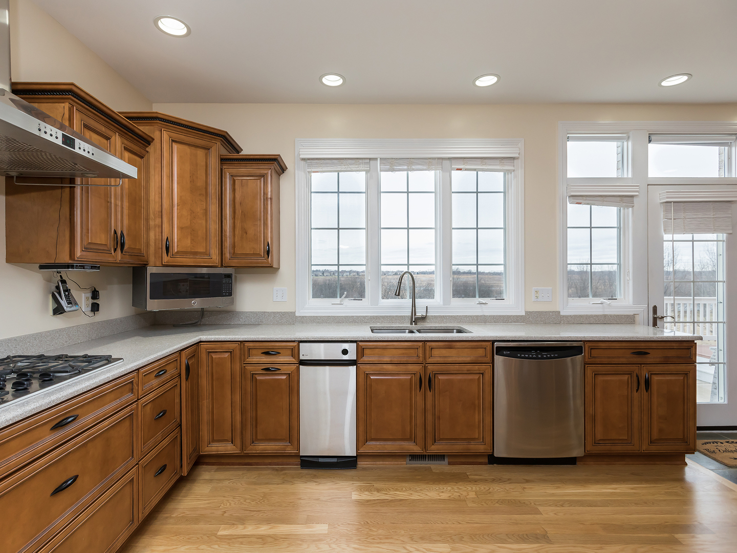 3N480 Fair Oaks Road West Chicago, IL 60185 - Photo 8 of 25 a large kitchen with stainless steel appliances granite countertop a sink and cabinets