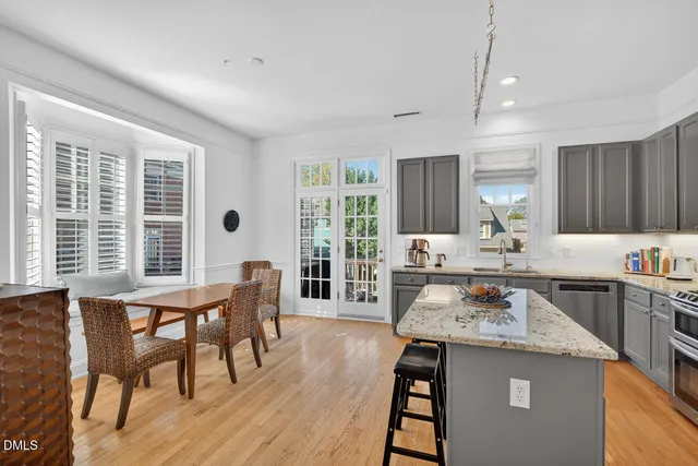 a dining room with furniture and windows