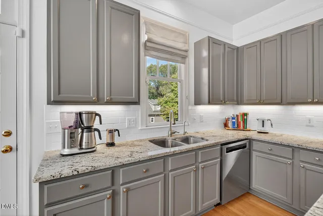 a view of kitchen island with granite countertop furniture and wooden floor