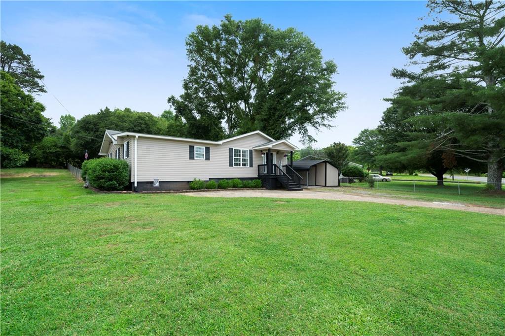 1275 Chulio Road Southeast Rome, GA 30161 - Photo 1 of 1 a house view with a garden space