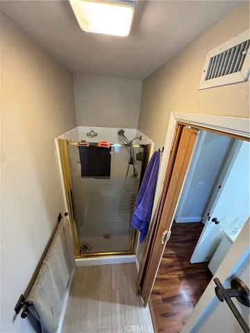 a view of a hallway with furniture and stairs