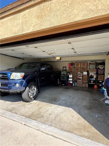 a view of parking garage with cars