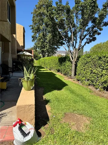 a view of yard with patio