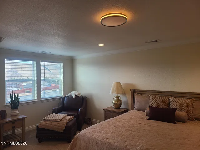 a bedroom with bed and window