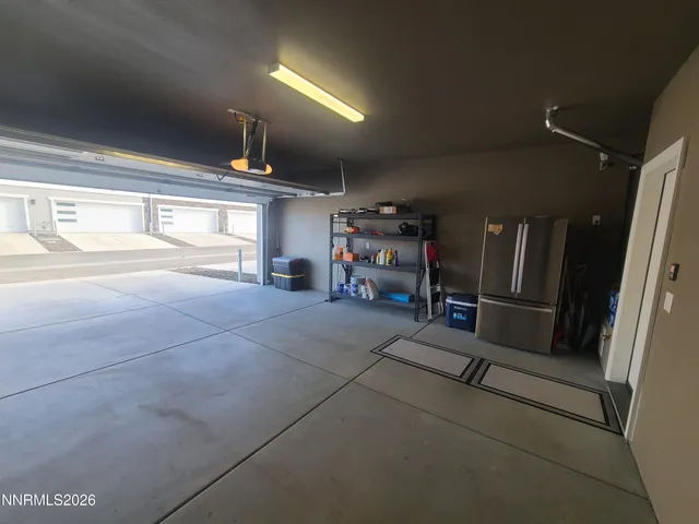 a view of an empty room with gym equipment