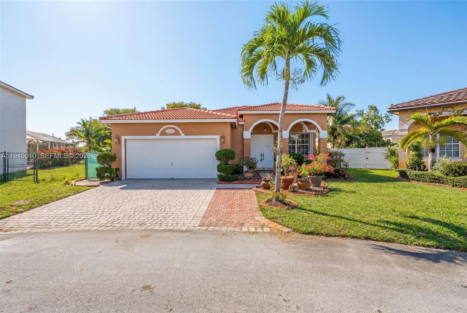 13296 Southwest 54th Court Miramar, FL 33027 - Photo 1 of 34 a front view of a house with garden and porch