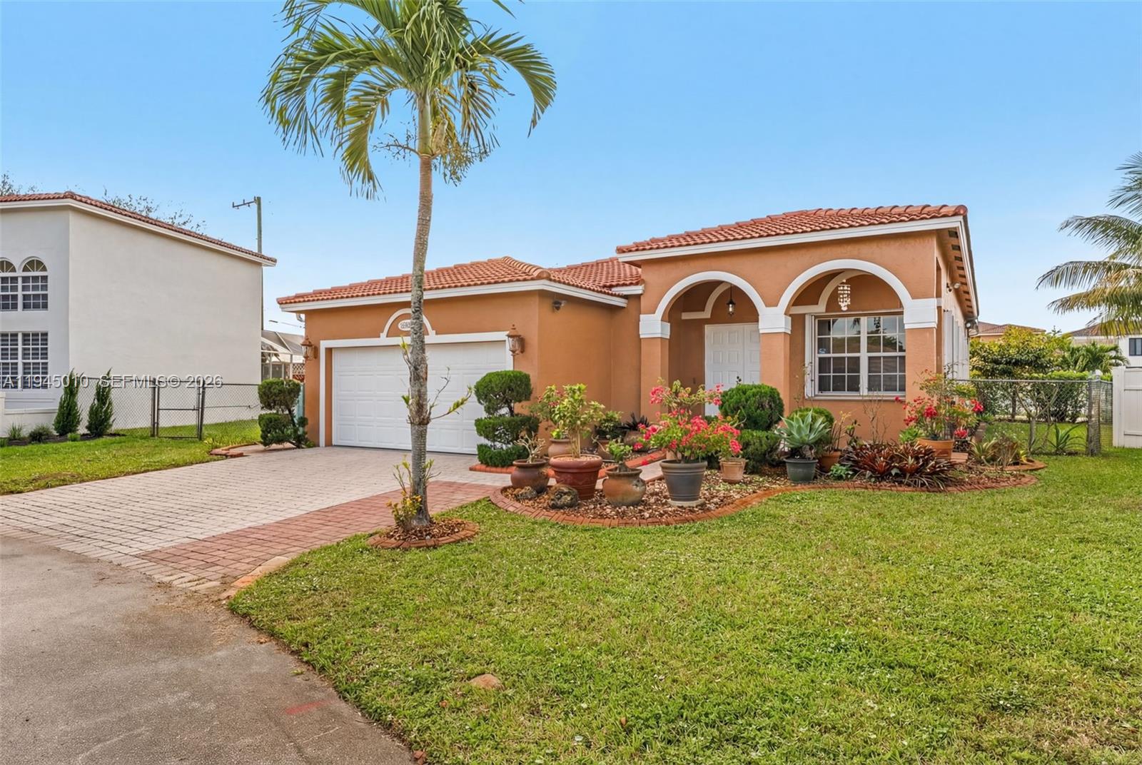 13296 Southwest 54th Court Miramar, FL 33027 - Photo 23 of 34 a front view of a house with garden