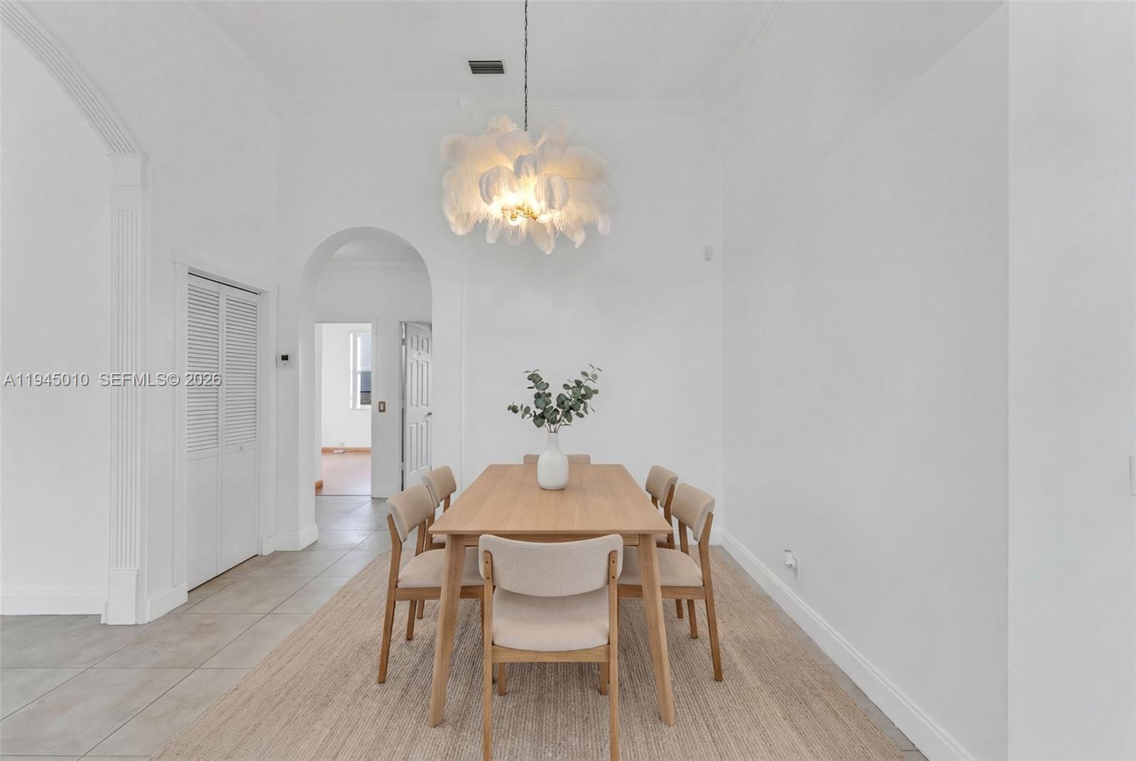 13296 Southwest 54th Court Miramar, FL 33027 - Photo 27 of 34 a view of a dining room with furniture and wooden floor