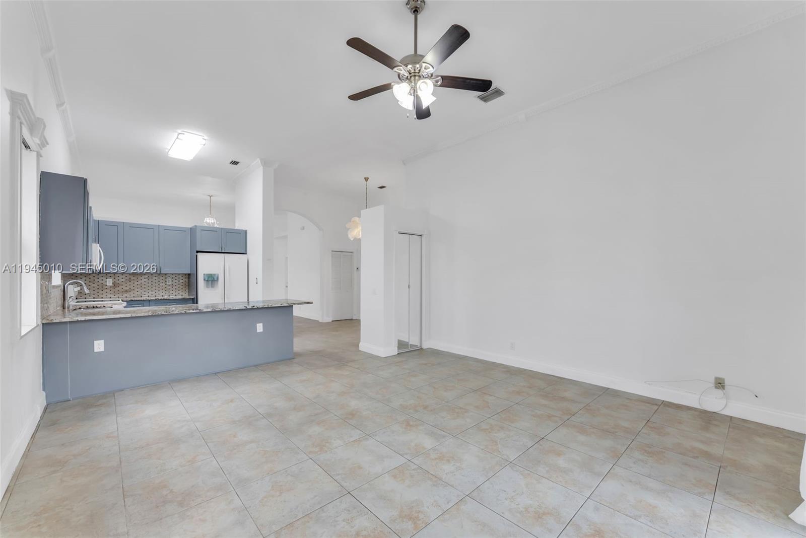 13296 Southwest 54th Court Miramar, FL 33027 - Photo 34 of 34 a large kitchen with cabinets and stainless steel appliances