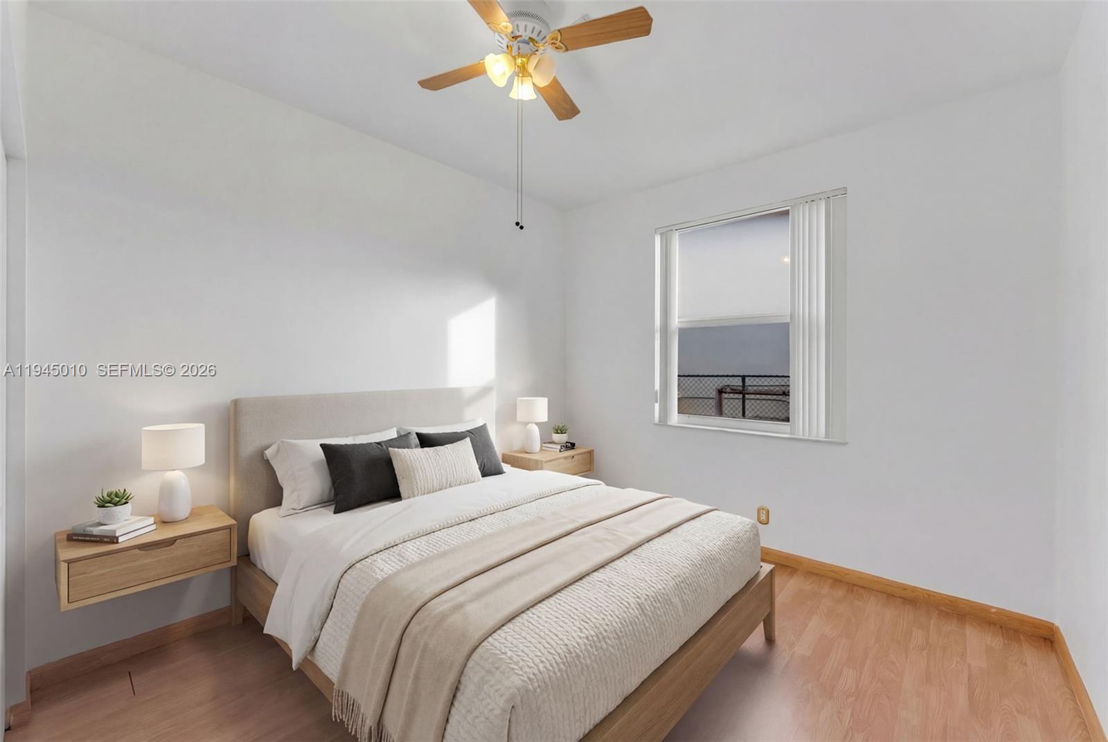 13296 Southwest 54th Court Miramar, FL 33027 - Photo 4 of 34 a bedroom with a bed and a chandelier