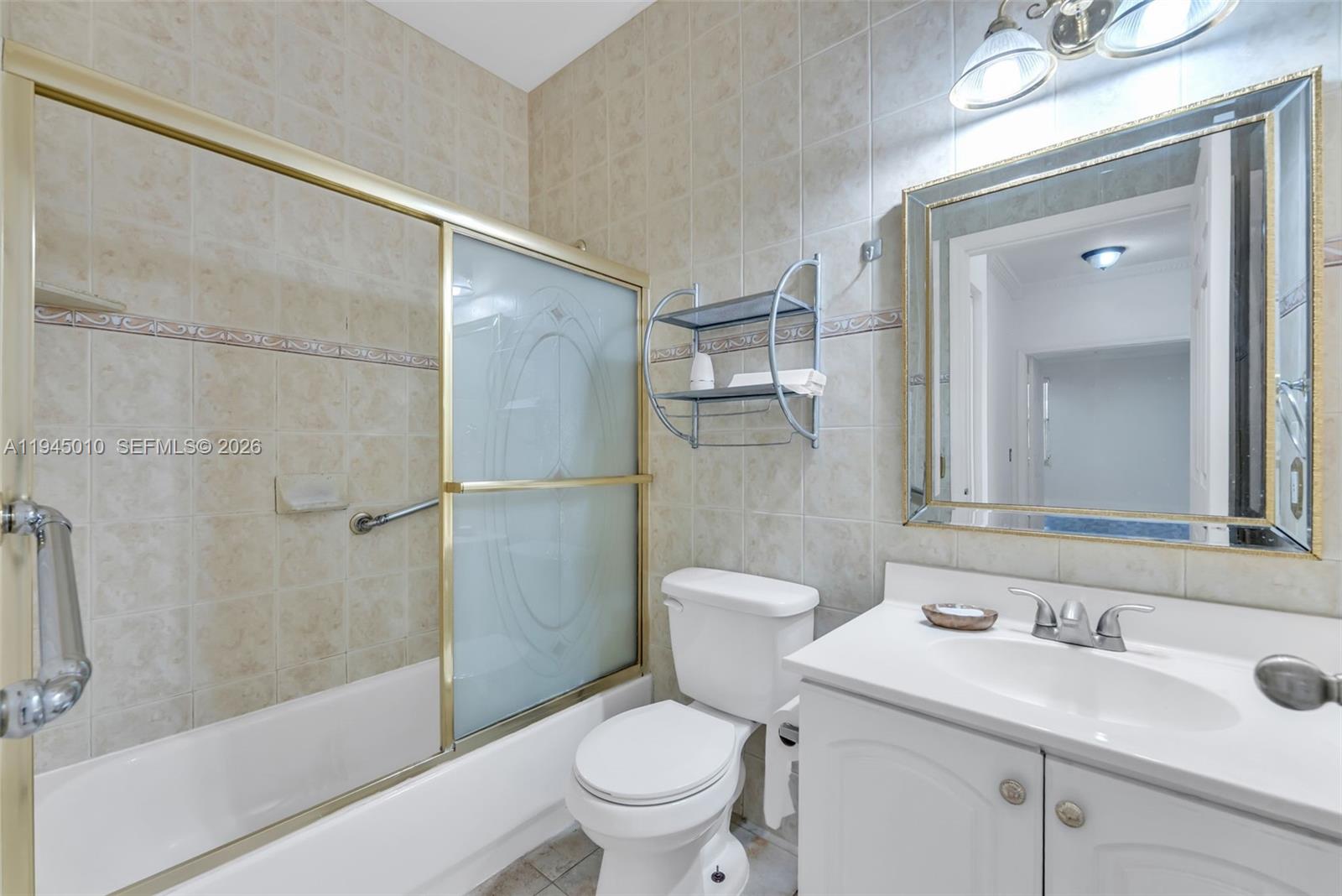 13296 Southwest 54th Court Miramar, FL 33027 - Photo 7 of 34 a bathroom with a sink toilet and shower