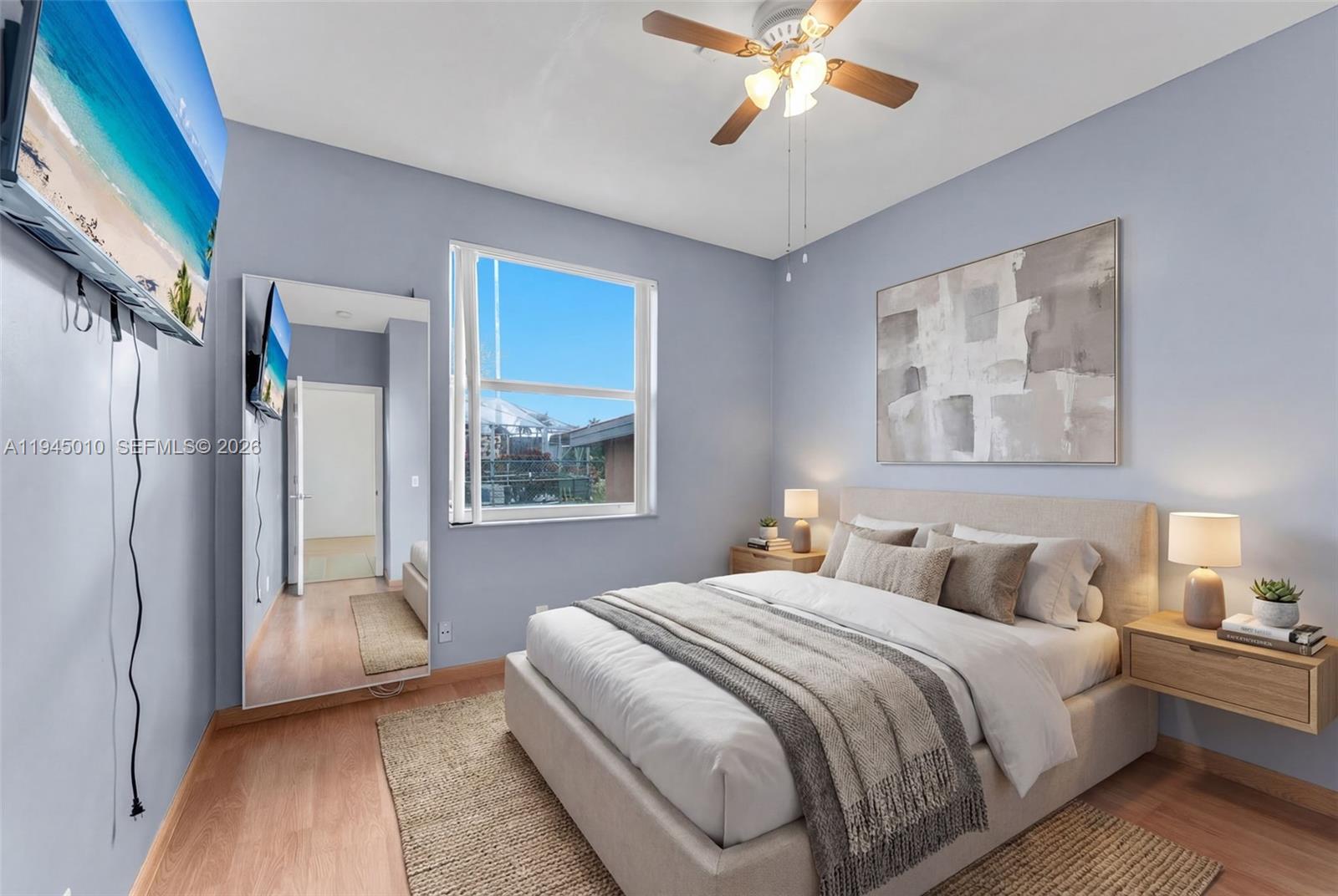 13296 Southwest 54th Court Miramar, FL 33027 - Photo 8 of 34 a bedroom with a bed and a painting on the wall