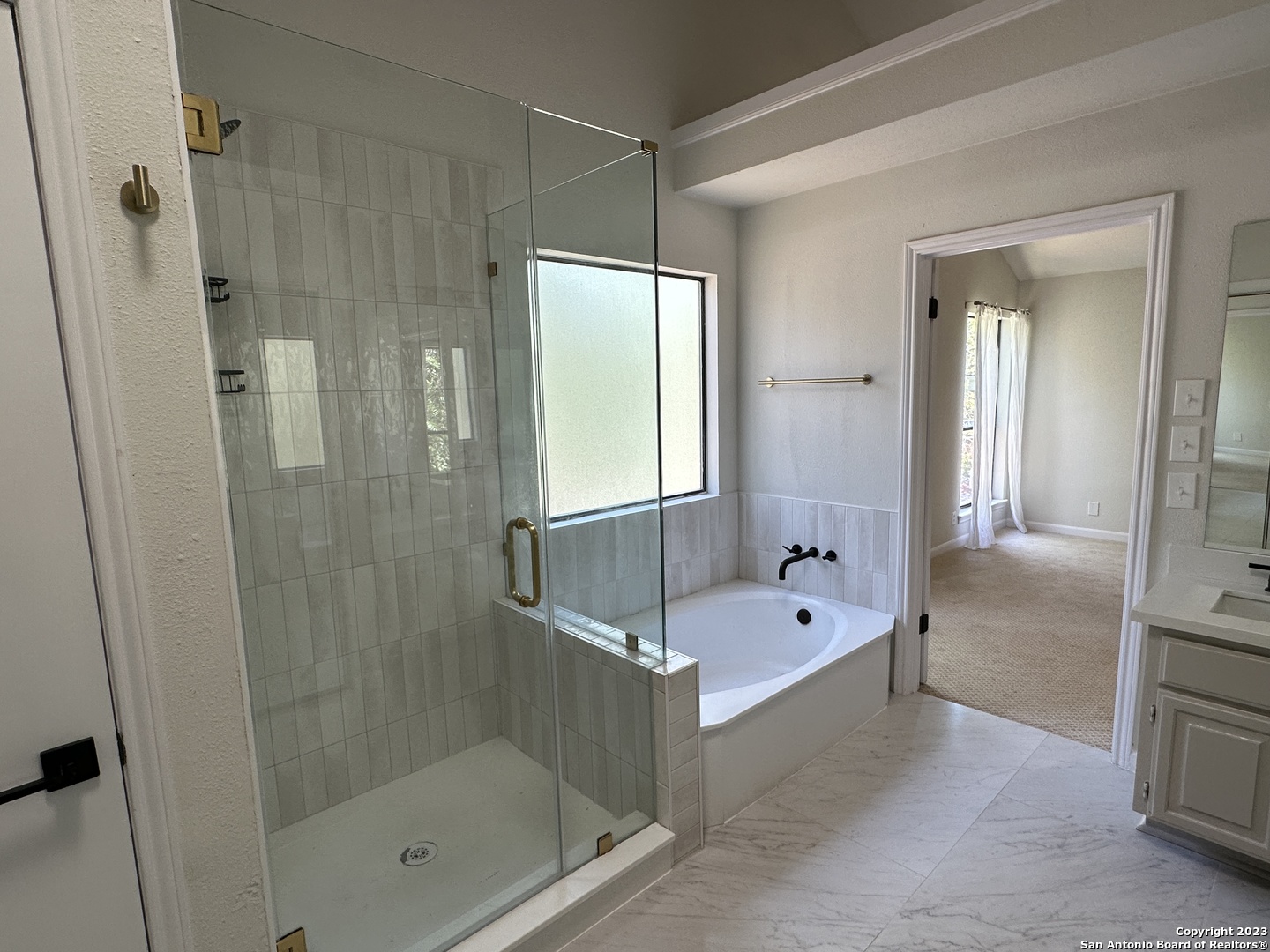 1722 Encino Spring San Antonio, TX 78259 - Photo 15 of 55 a bathroom with a tub shower and sink