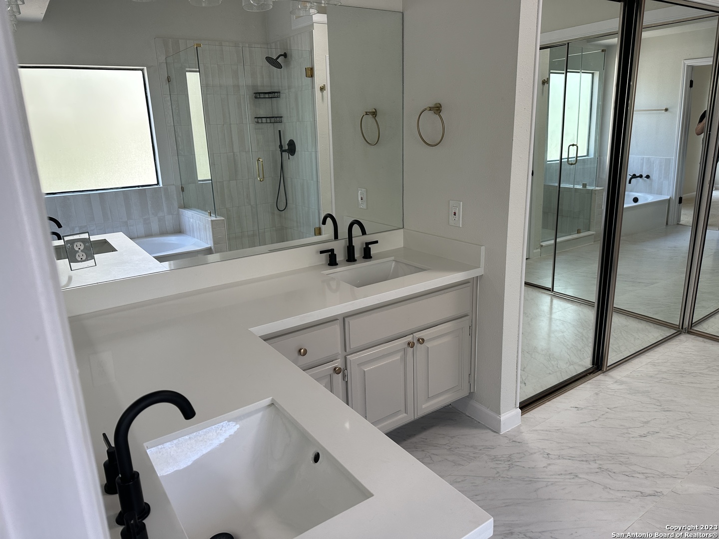 1722 Encino Spring San Antonio, TX 78259 - Photo 16 of 55 a bathroom with a sink and a mirror
