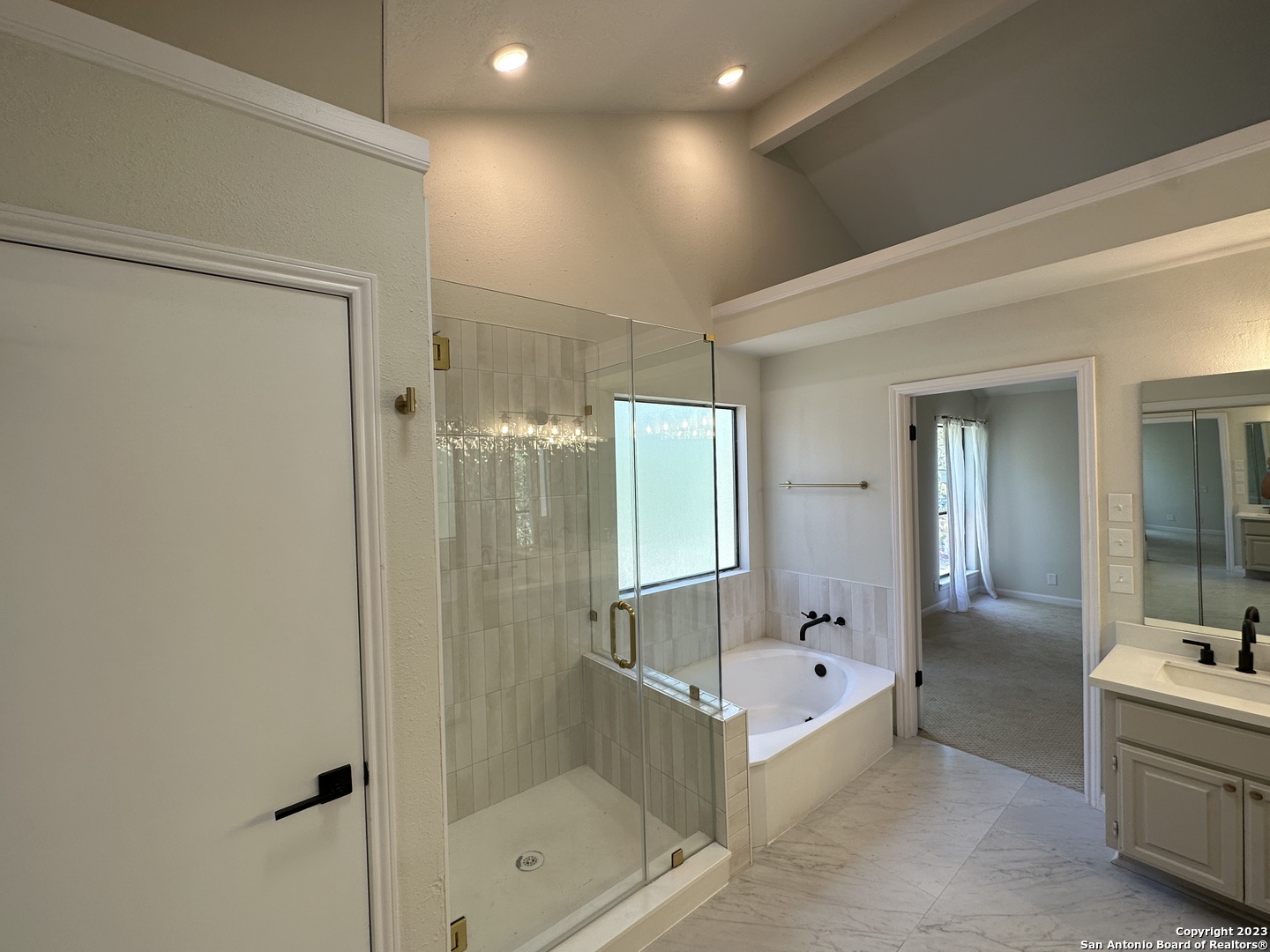 1722 Encino Spring San Antonio, TX 78259 - Photo 17 of 55 a bathroom with a double vanity sink mirror and shower