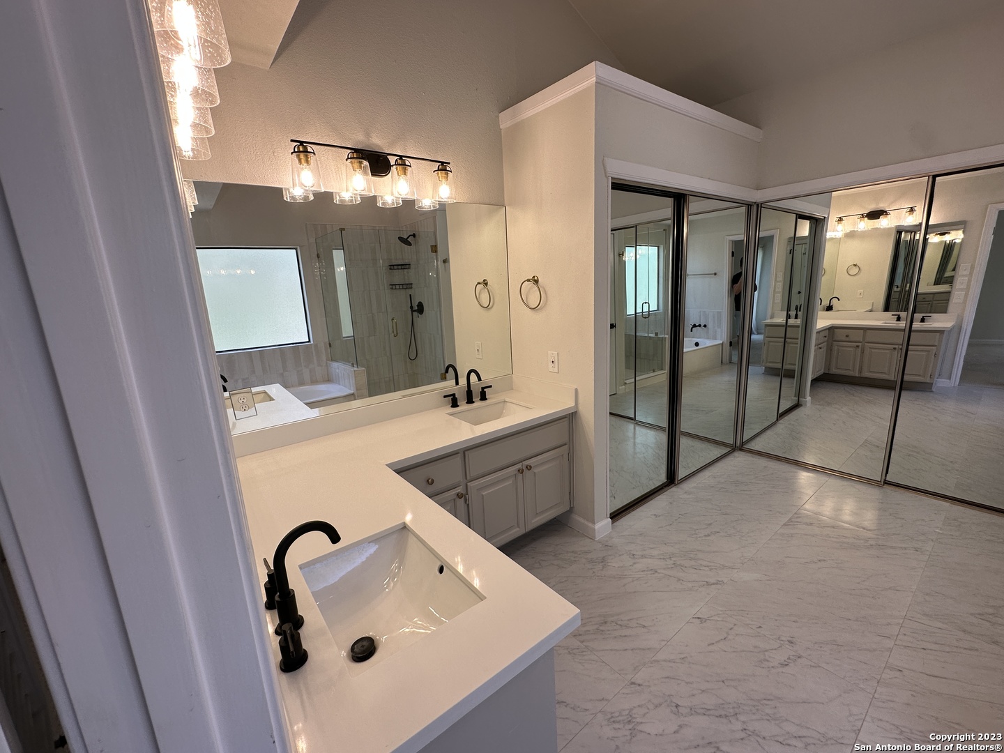 1722 Encino Spring San Antonio, TX 78259 - Photo 20 of 55 a bathroom with a double vanity sink mirror and shower