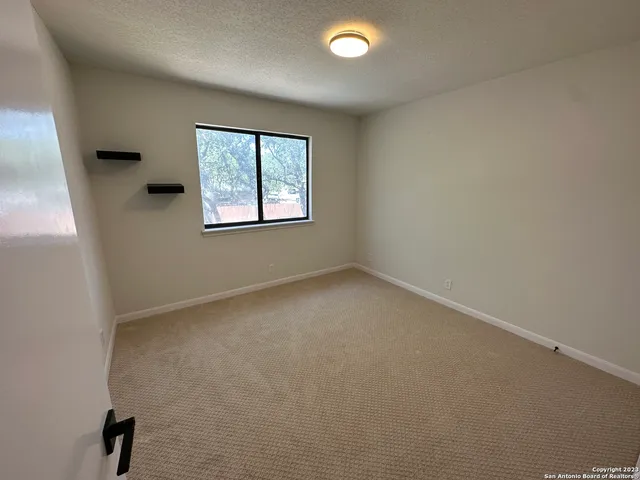a living room with furniture a chandelier and a couch