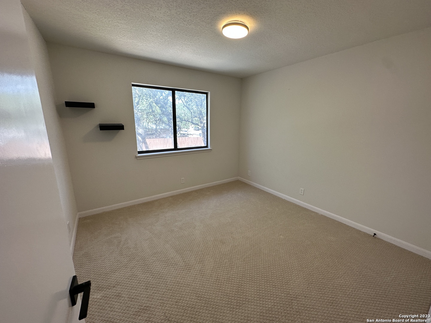 1722 Encino Spring San Antonio, TX 78259 - Photo 23 of 55 an empty room with a window