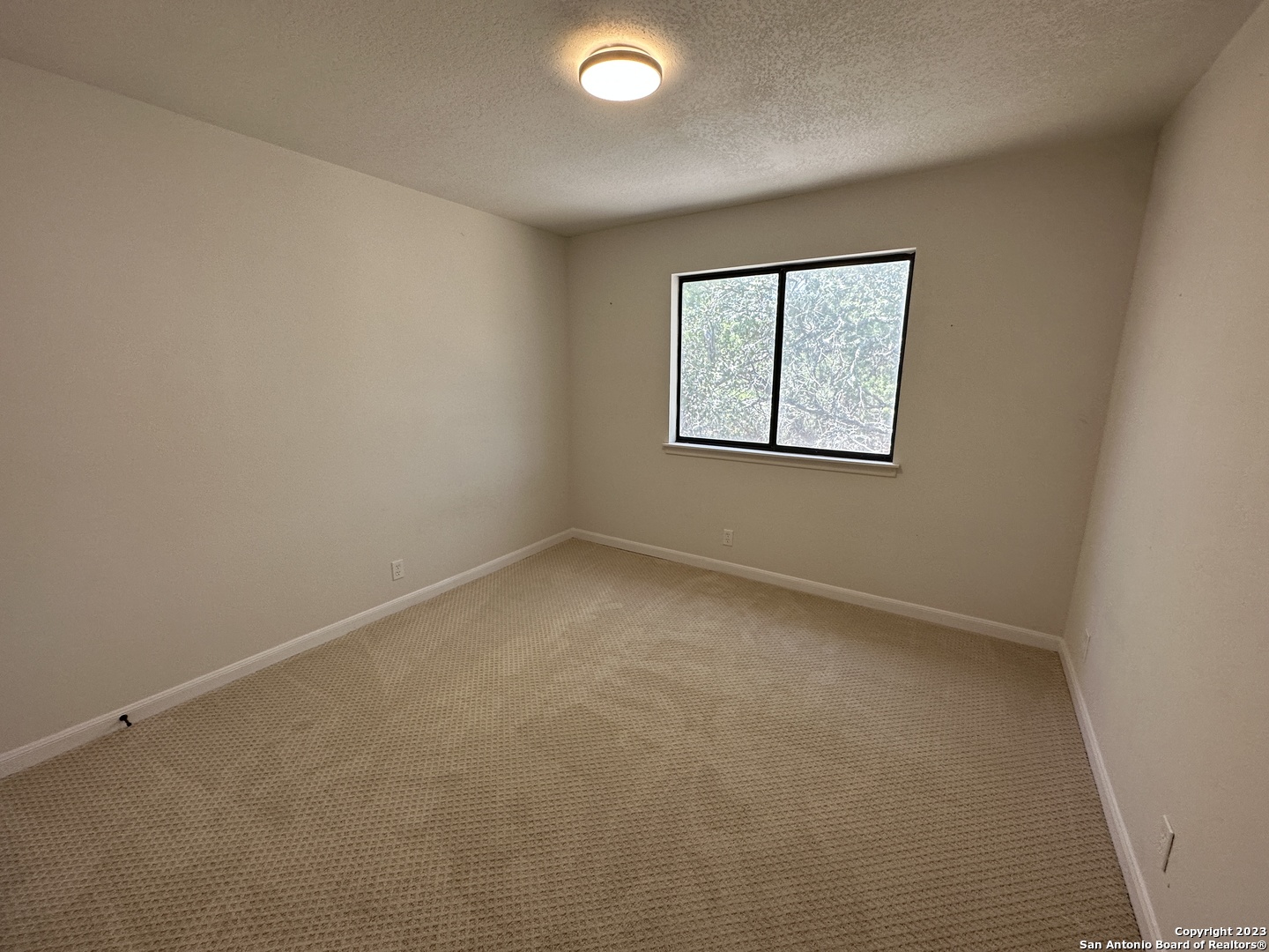 1722 Encino Spring San Antonio, TX 78259 - Photo 24 of 55 an empty room with a window
