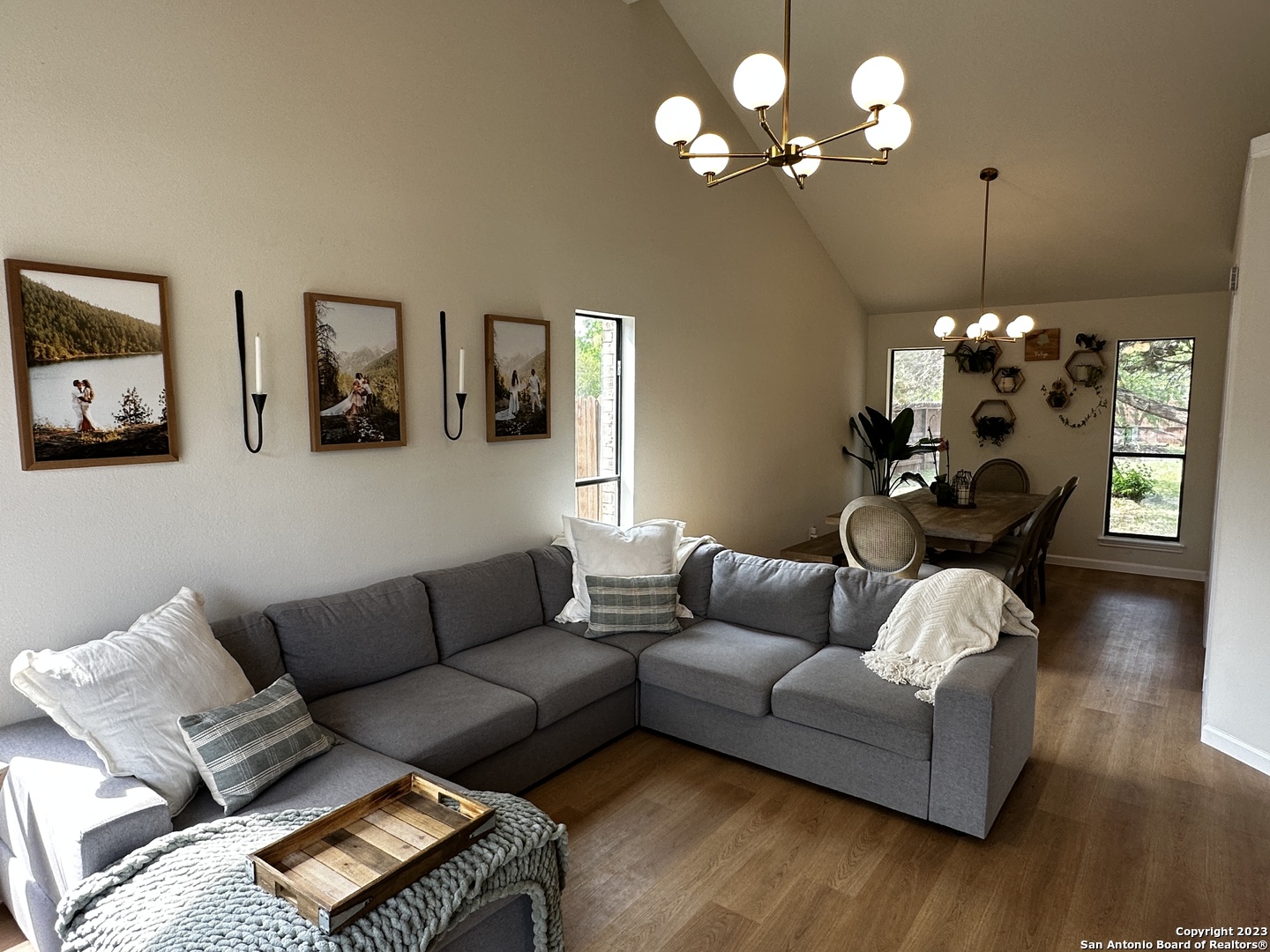 1722 Encino Spring San Antonio, TX 78259 - Photo 27 of 55 a living room with furniture a chandelier and a couch