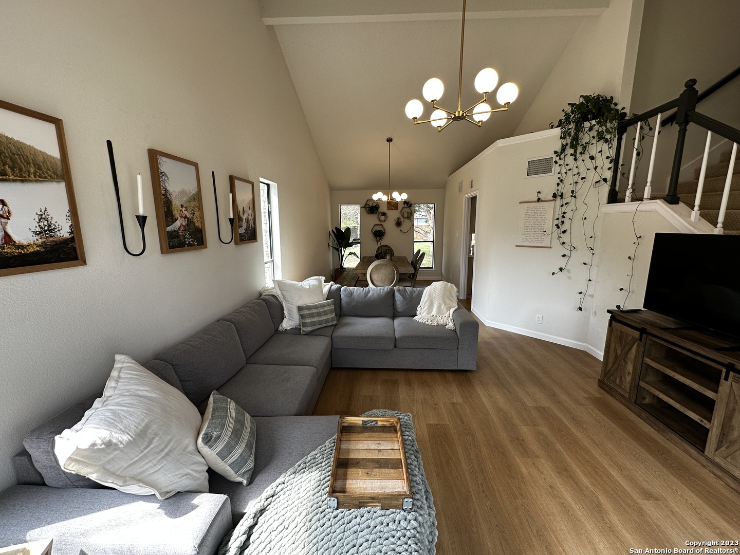 1722 Encino Spring San Antonio, TX 78259 - Photo 28 of 55 a living room with furniture and a chandelier