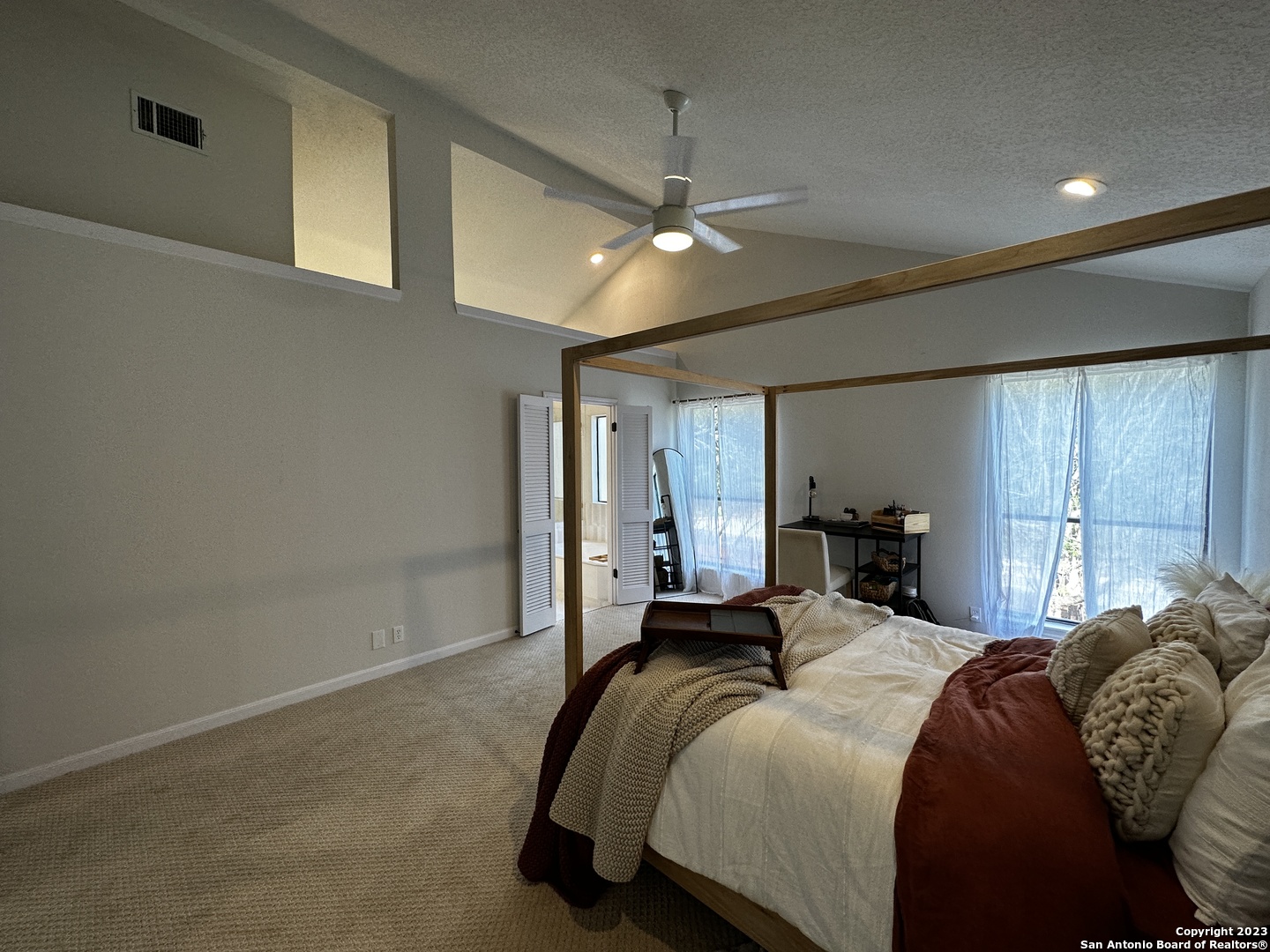1722 Encino Spring San Antonio, TX 78259 - Photo 41 of 55 a bedroom with a bed ceiling fan and a window