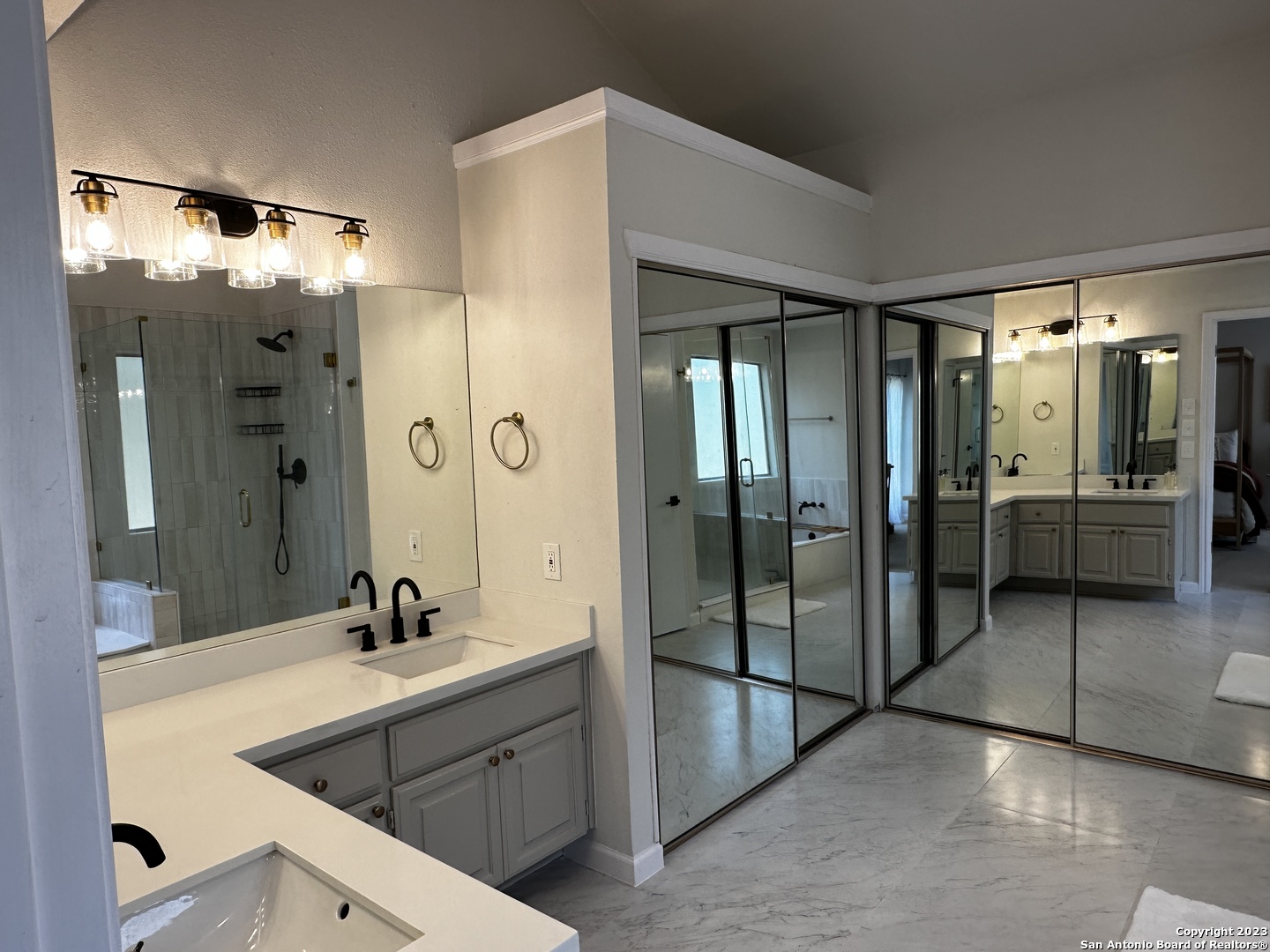 1722 Encino Spring San Antonio, TX 78259 - Photo 45 of 55 a bathroom with a double vanity sink mirror and shower