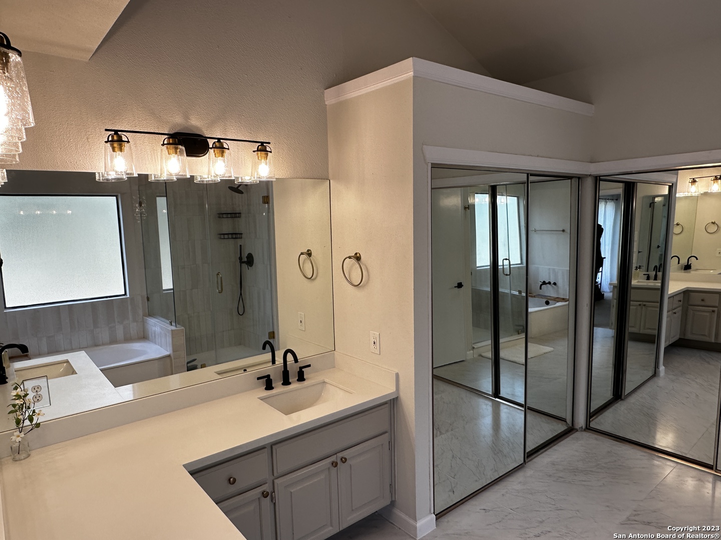 1722 Encino Spring San Antonio, TX 78259 - Photo 47 of 55 a bathroom with a double vanity sink mirror and shower