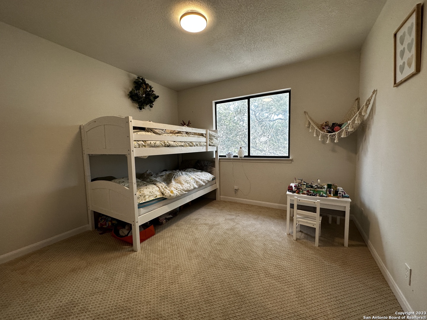 1722 Encino Spring San Antonio, TX 78259 - Photo 48 of 55 a bedroom with a bed and a window