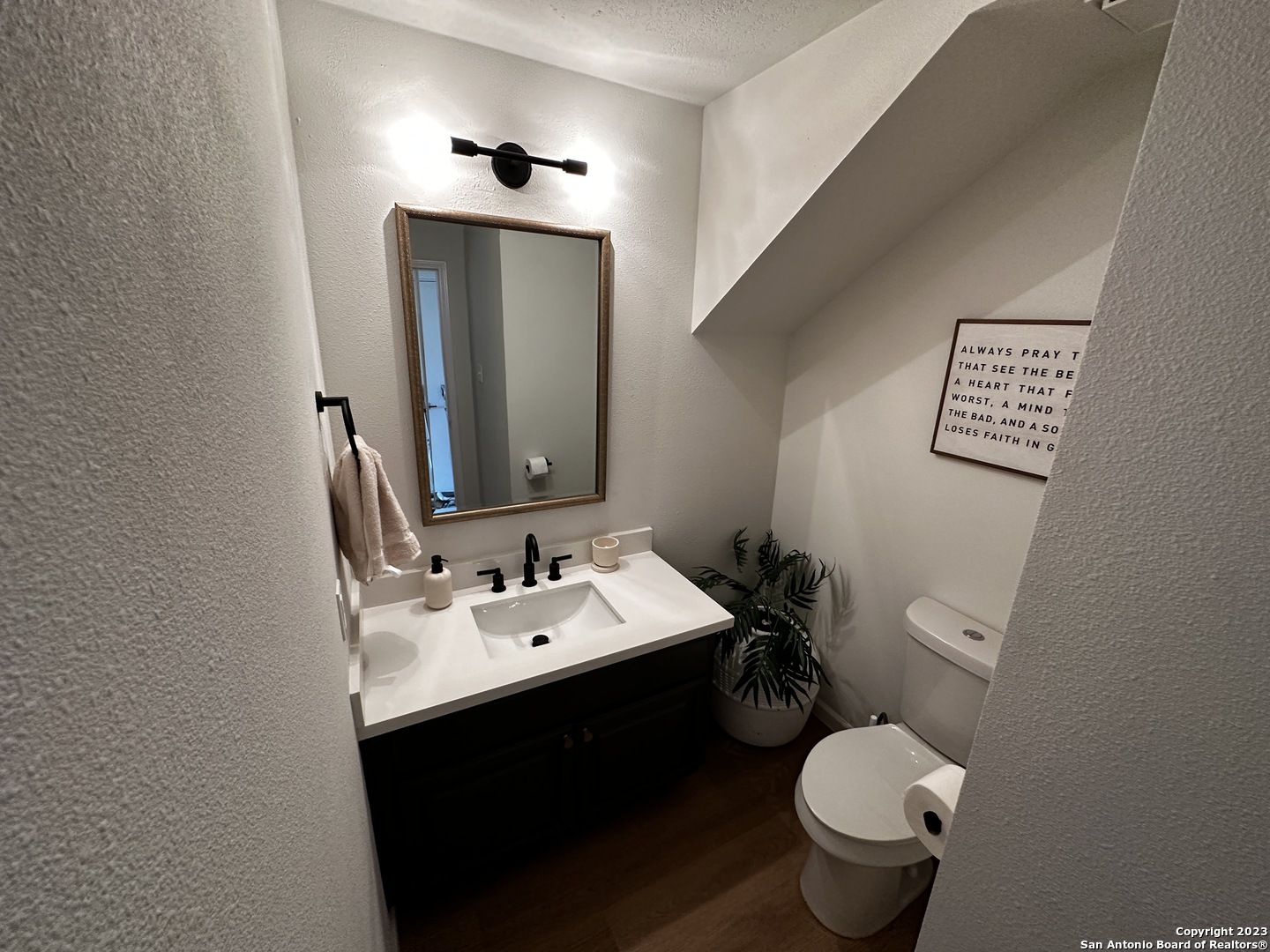 1722 Encino Spring San Antonio, TX 78259 - Photo 54 of 55 a bathroom with a toilet sink and mirror