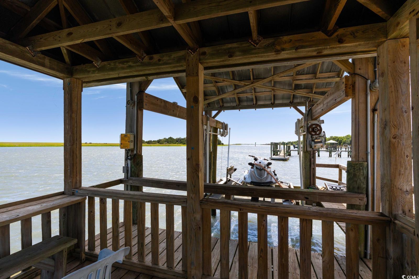 315 Lofton Court McClellanville, SC 29458 - Photo 12 of 40 Dock area featuring a water view and boat lift