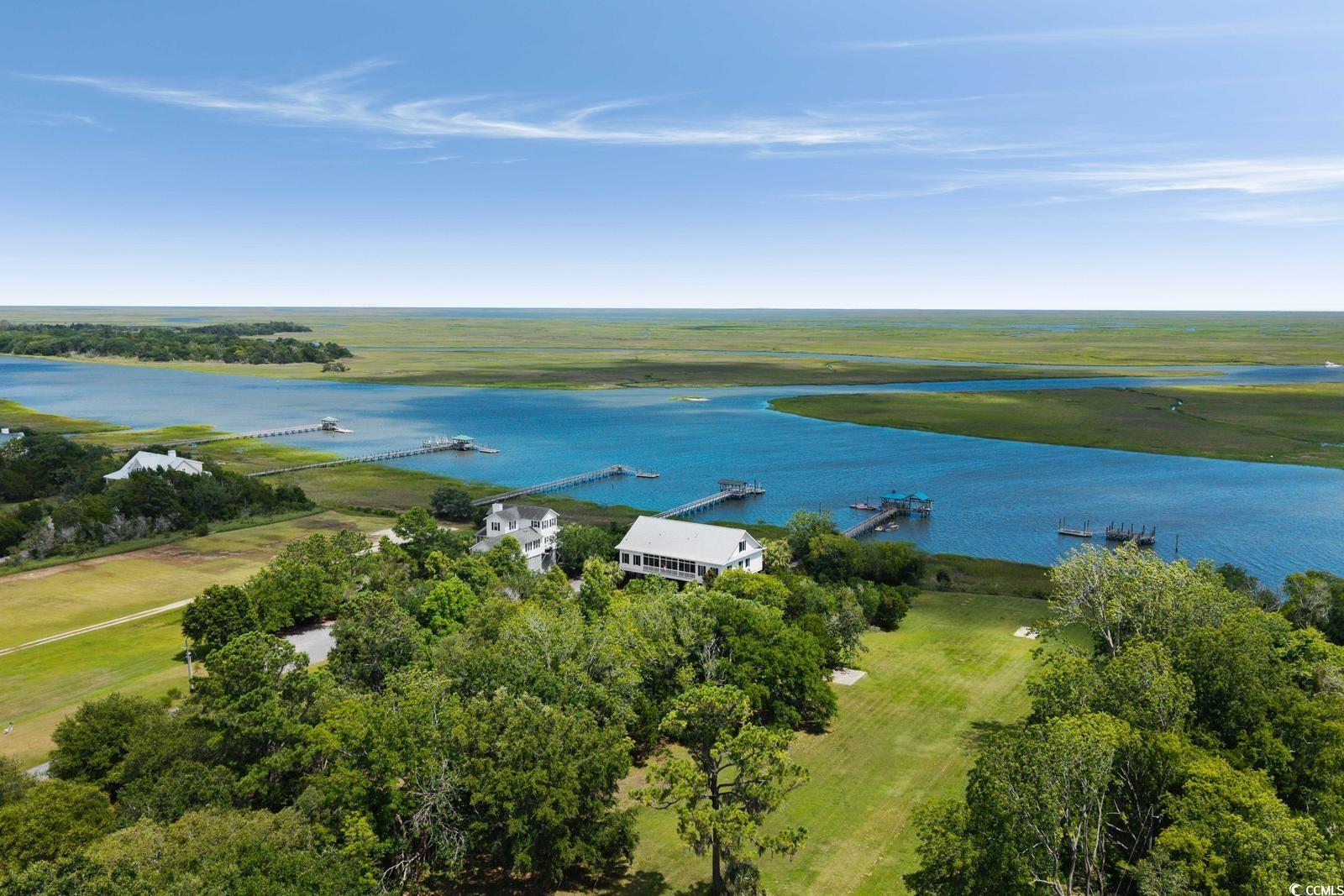 315 Lofton Court McClellanville, SC 29458 - Photo 3 of 40 Bird's eye view of a large body of water