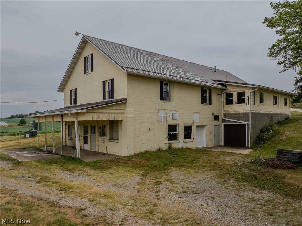 Rear view of property featuring a patio area