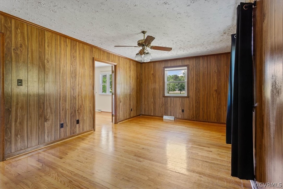 2001 Point Of Rocks Road Chester, VA 23836 - Photo 18 of 25 wooden floor in an empty room with a window
