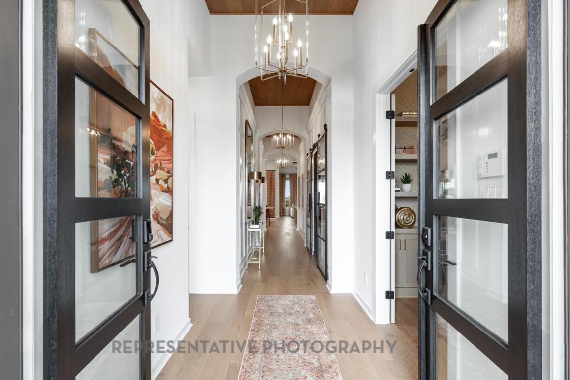 205 Leaning Rock Ridge Austin, TX 78737 - Photo 12 of 40 a view of a hallway and a livingroom with furniture