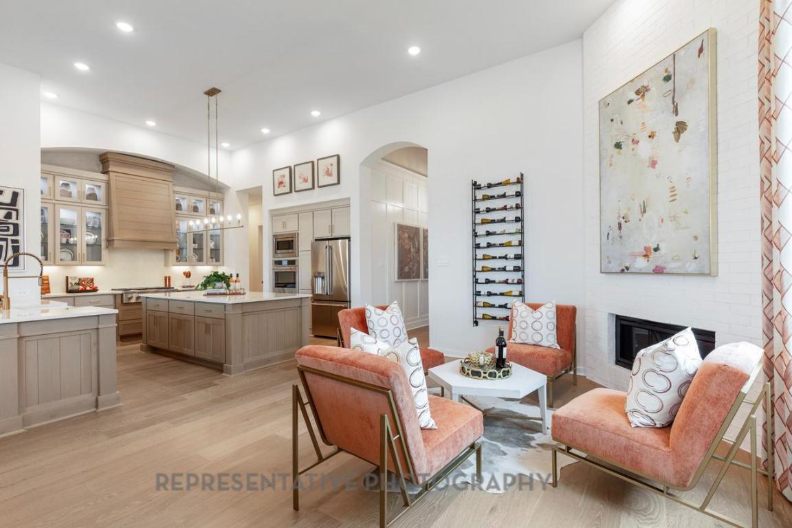 205 Leaning Rock Ridge Austin, TX 78737 - Photo 19 of 40 a living room with furniture kitchen view and a large window