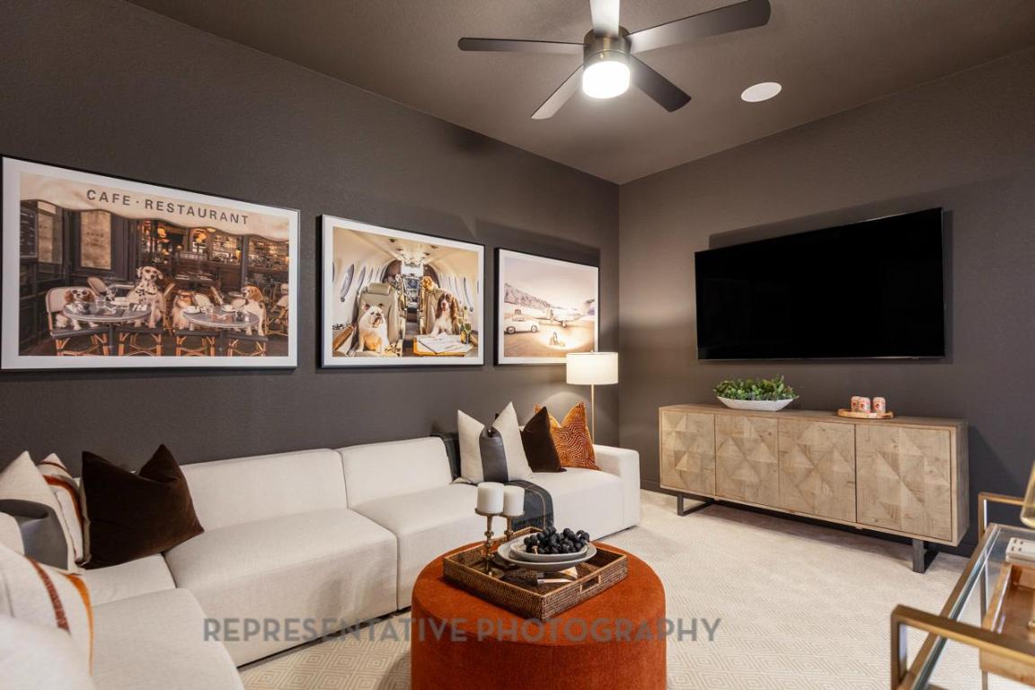 205 Leaning Rock Ridge Austin, TX 78737 - Photo 20 of 40 a living room with furniture and a flat screen tv