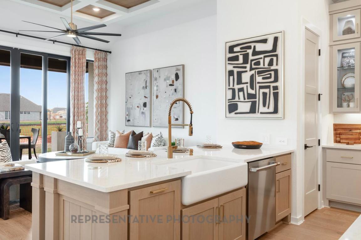205 Leaning Rock Ridge Austin, TX 78737 - Photo 29 of 40 a kitchen with a sink stove and cabinets