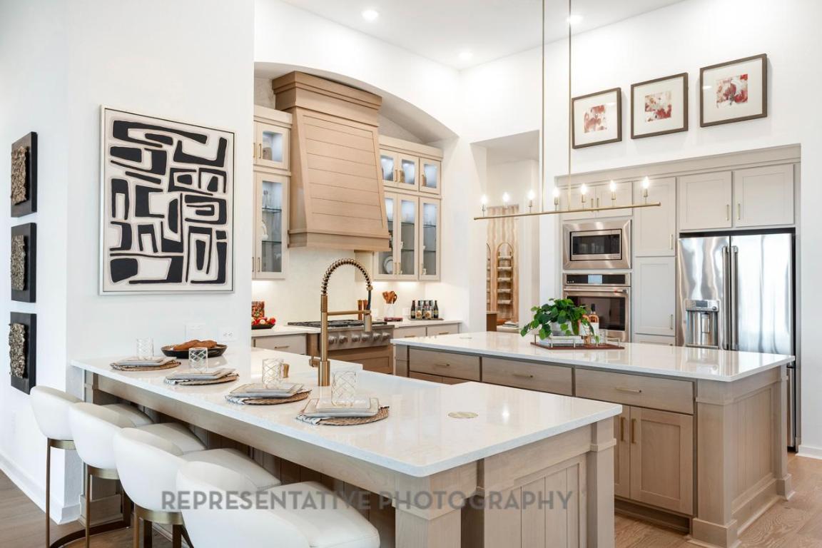 205 Leaning Rock Ridge Austin, TX 78737 - Photo 31 of 40 a kitchen with a sink stove and cabinets