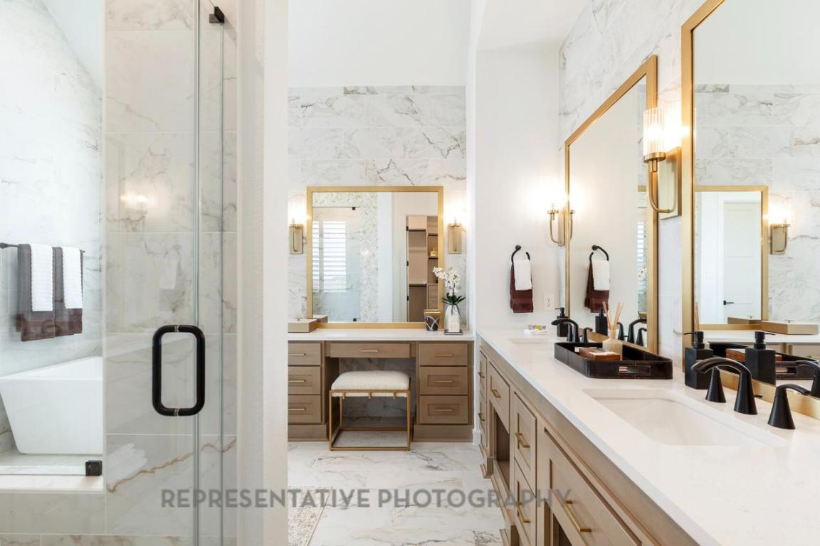 205 Leaning Rock Ridge Austin, TX 78737 - Photo 34 of 40 a view of a bathroom with dual sinks