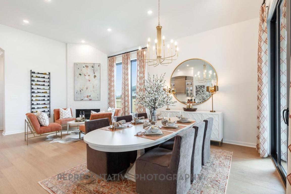 205 Leaning Rock Ridge Austin, TX 78737 - Photo 37 of 40 a view of a kitchen area with furniture and chandelier