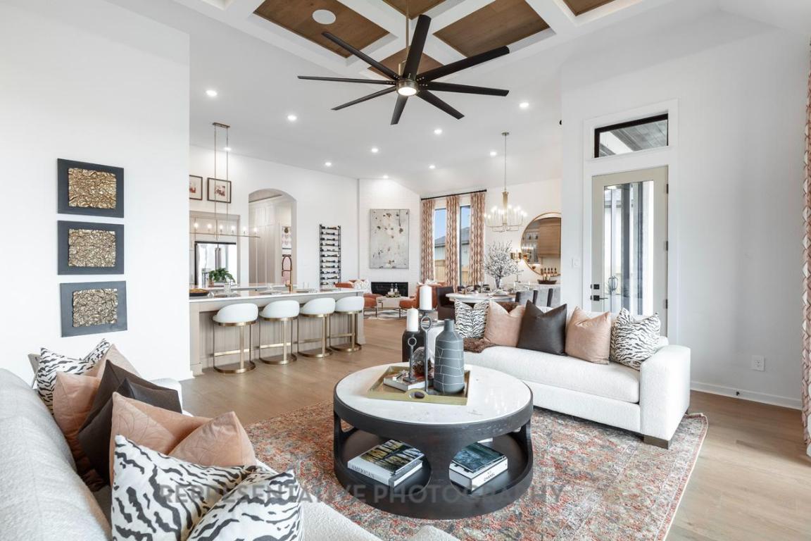 205 Leaning Rock Ridge Austin, TX 78737 - Photo 6 of 40 a living room with furniture and a large window