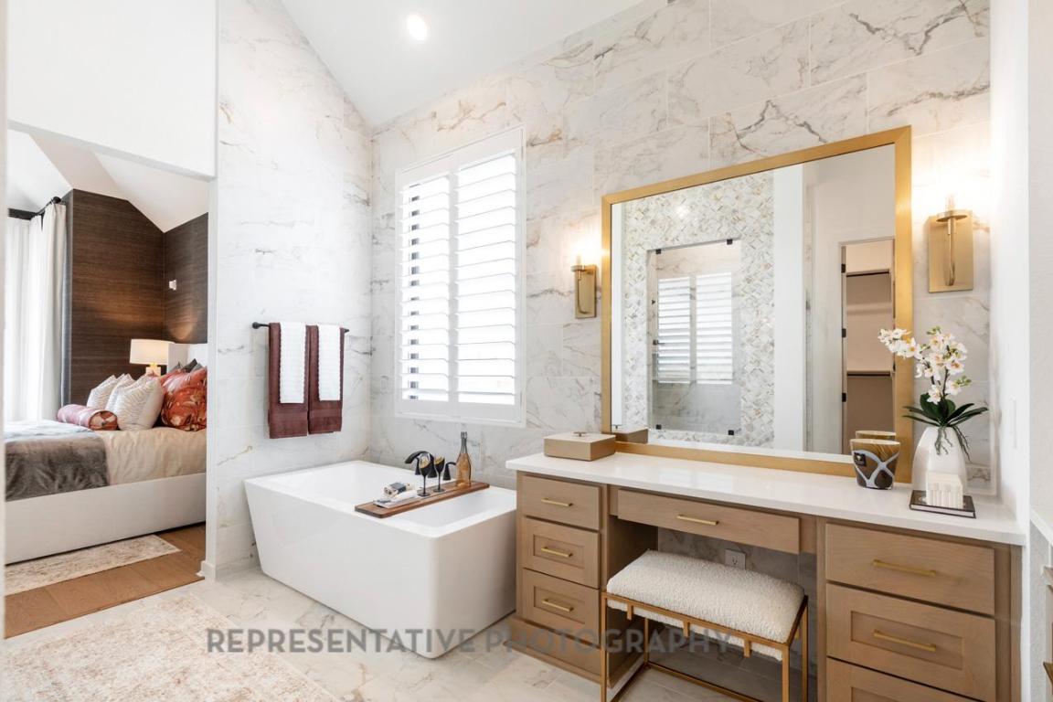 205 Leaning Rock Ridge Austin, TX 78737 - Photo 9 of 40 a bathroom with a tub sink and mirror