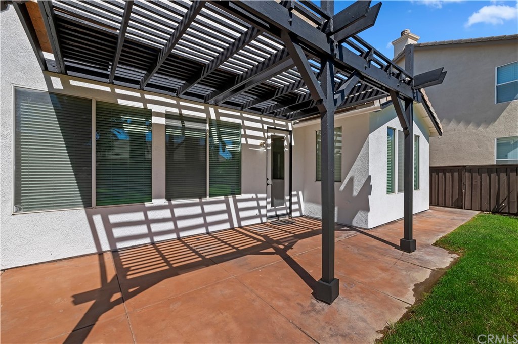 13527 Jasper Loop Eastvale, CA 92880 - Photo 33 of 37 a building outdoor space with patio furniture